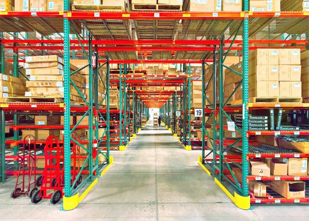 A warehouse is filled with shelves and boxes